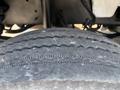 Close-up of a worn tire with visible cracks and uneven tread on a 2006 Sterling Acterra
