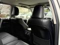 The interior of a 2018 Toyota 4Runner showcasing black leather seats and headrests with a focus on the rear seating area