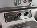 Control panel with knobs for fan speed and temperature settings in a 2021 Freightliner M2 106
