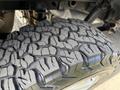 Close-up of a tire tread on a 2018 Ford F-150 showcasing deep grooves and rugged patterns designed for traction on various terrains