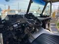 The interior of a 2008 Workhorse W62 with a steering wheel dashboard controls and seats showing a driver-centric layout