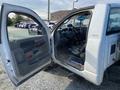 A 2009 Dodge Ram 5500 with its driver's side door open revealing an interior that includes a steering wheel and seats