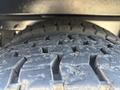Close-up of a worn tire tread on a 2013 International 7500 showing grooves and textures in the rubber