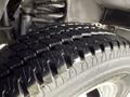 Close-up of a 2012 Ford Econoline tire showing detailed tread pattern and sidewall structure