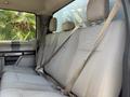 Interior of a 2019 Ford F-550 with gray cloth seats and seatbelts visible on the rear bench seat