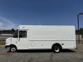A 2012 Ford Econoline delivery van in white with the Purulator logo displayed on its side
