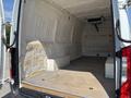 Interior of a 2019 Mercedes-Benz Sprinter van featuring a spacious cargo area with a wooden floor and insulated walls