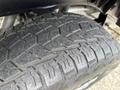 A close-up view of a tire from a 2017 Chevrolet Colorado showcasing the tread pattern and rubber texture