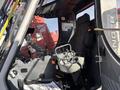 Interior view of a 2018 Sandvik Ranger DX800 featuring a control panel a seat and various controls including levers and buttons
