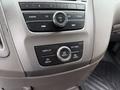 Control panel of a 2014 Honda Odyssey featuring buttons for audio settings display options and a control knob for menu navigation