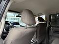 Interior view of a 2014 Honda Odyssey showing the back of the front seats and the headrests in gray fabric