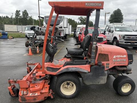 A 2015 Kubota F3990 lawn mower with a red and grey body features a high seat and steering wheel with a mower deck attached at the front