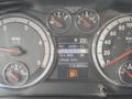The dashboard of a 2011 Dodge Ram 5500 displaying various gauges including RPM fuel economy tire pressure and vehicle information