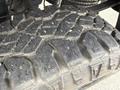 A close-up view of a rugged tire tread on a 2017 Chevrolet Silverado 1500 showcasing deep grooves and a worn surface suitable for off-road driving