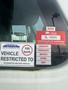 A 2007 International 7300 truck displaying various vehicle compliance stickers and a certificate of approval for 2026