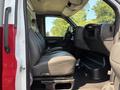 Interior of a 2007 GMC C4500 TopKick featuring leather seats with a spacious driver's area and dashboard controls visible