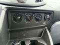 Dashboard controls of a 2019 Ford Transit including knobs for climate control and a 12V power outlet