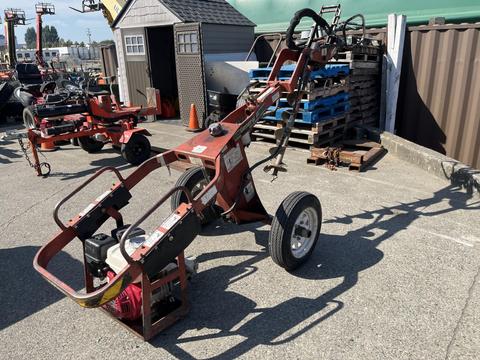 A General 660H Dig-R-Mobile Auger with a red frame a handle and an auger bit attached to the front designed for digging holes in various terrains