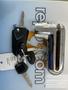 A 2018 Honda Grom motorcycle key with a silver keyring and several keys attached