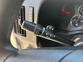 A close-up of the turn signal and windshield wiper controls on the steering column of a 2020 Chevrolet Express