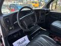 Interior of a 2007 GMC C4500 TopKick showcasing the steering wheel dashboard and leather seats with a thank you note on the floor