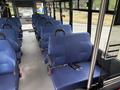 Interior of a 2020 Chevrolet Express with multiple blue seats and seat belts arranged in rows