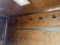 Interior of a 2016 Continental cargo trailer featuring wooden walls metal track and hooks for securing items