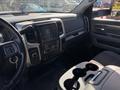 Interior view of a 2014 RAM 5500 featuring a steering wheel and a dashboard with a touchscreen display and various controls
