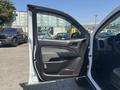 2017 Chevrolet Colorado with the driver's door open showcasing the interior and control panel elements
