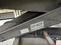 Close-up of a 2017 Autocar Xpert chassis featuring a LO-BOY conversion hoist labeled with the model and manufacturer details