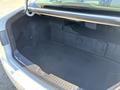 The trunk of a 2015 Hyundai Sonata with a spacious, carpeted interior devoid of any items or obstructions