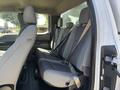 A 2019 Ford F-150 with gray fabric seats in the back row showcasing three seating positions and safety seatbelts