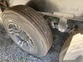 Close-up of a tire on a 2021 Grand Design Recreational ST3478MBS showcasing the tread pattern and rim design