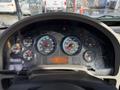 Dashboard of a 2010 International 4300 truck displaying various gauges including RPM speed and volt meters