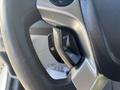 Close-up of the steering wheel controls of a 2017 Ford Transit-350 featuring buttons for cruise control and menu settings