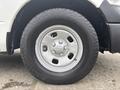 A close-up view of a 2016 RAM 1500 tire and wheel featuring a silver metal rim and a rugged black tire tread pattern