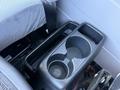 A black plastic cup holder designed for a 2015 Hino 358 featuring two compartments for beverages