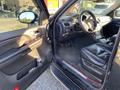 Interior of a 2007 Cadillac Escalade featuring leather seats a center console and various controls