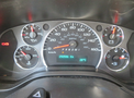 Dashboard of a 2020 Chevrolet Express with speedometer fuel gauge and engine temperature display showing 250586 Km and 28°C