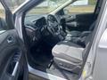 Interior of a 2015 Ford Escape featuring a gray dashboard steering wheel and seats with a console and controls in the center