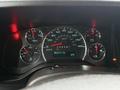 Dashboard of a 2019 Chevrolet Express showing speedometer fuel gauge temperature gauge and warning lights with a digital display reading 352293 km and temperature 9 degrees Celsius