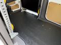 Interior view of a 2021 Ford Transit Connect cargo area featuring a flat floor and metal support racks on both sides