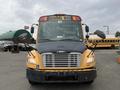A yellow 2007 Freightliner B2 school bus with large front windows and multiple mirrors is parked facing forward