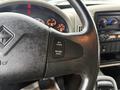 The steering wheel of a 2011 International 4400 featuring cruise control buttons labeled Set Cruise and Resume Accel