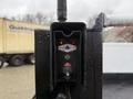 Control panel for a Tommie Gate featuring buttons for power activation and lift operation with indicators for up and on functions