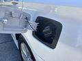 A 2015 Hyundai Sonata with its fuel door open displaying the fuel cap