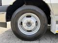 Close-up of a tire from a 2020 Chevrolet Express showing the Bridgestone brand and a silver wheel with multiple lug nut holes