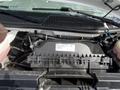 The image shows the engine compartment of a 2022 GMC Savana with various components visible including wiring and a plastic engine cover