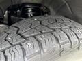 Close-up of a rugged tire tread on a 2017 Chevrolet Colorado showcasing deep grooves for traction