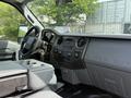 Interior view of a 2011 Ford F-350 SD with a focus on the dashboard showing controls and the Super Duty logo